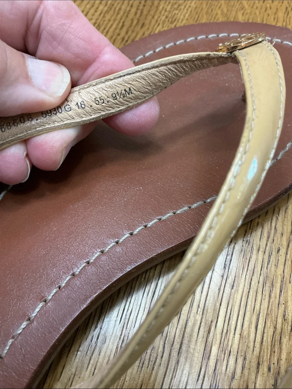 Woman’s Tory Burch tan patent leather thong sandal. Size 9.5. Leather. Like new!